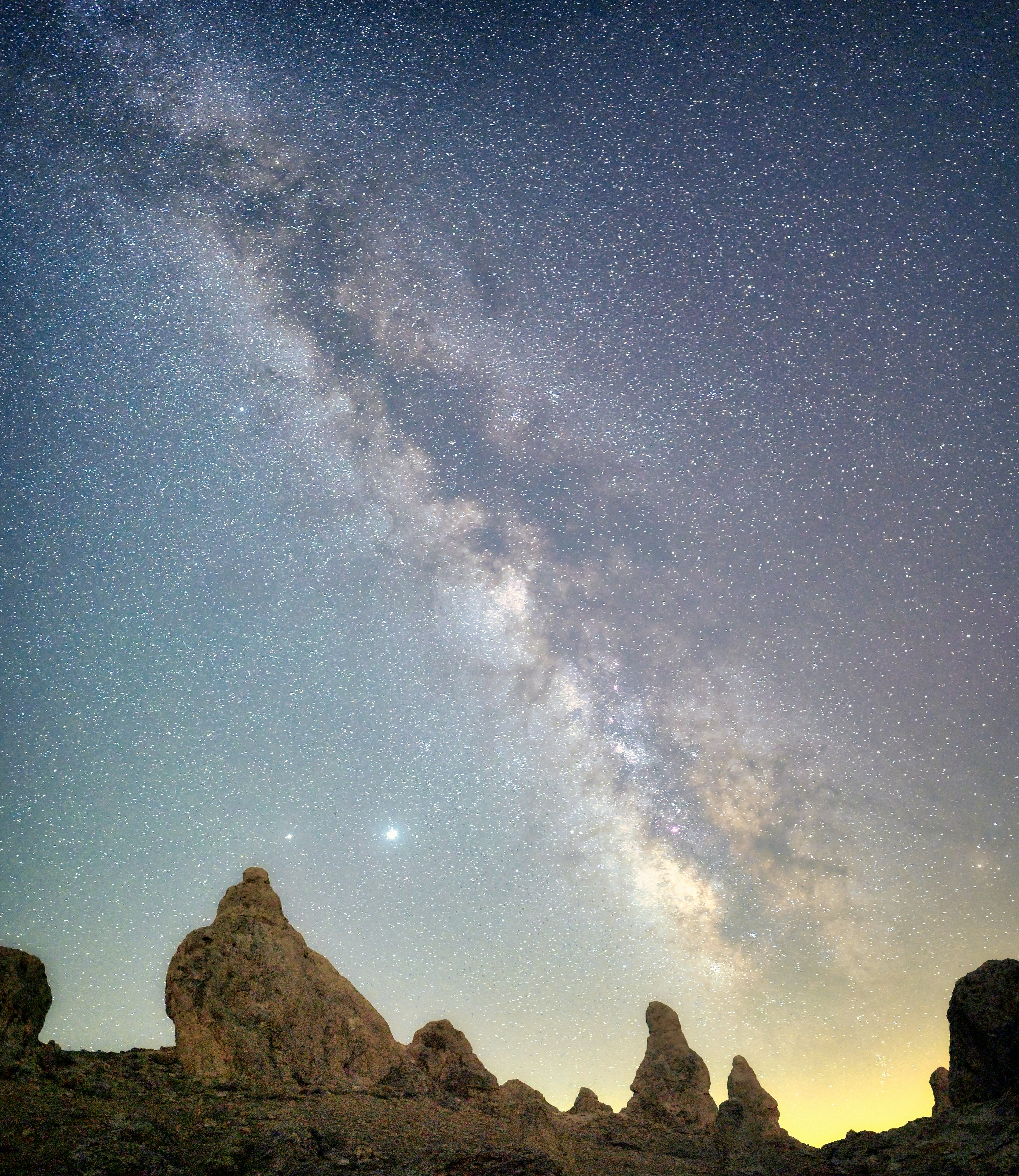 brown rocky mountain under blue sky during night time